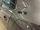 a car with a sticker on the side of it ' s door