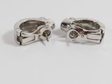 a pair of silver plated cuff rings with red stones