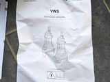 a white paper on the floor with instructions on it