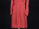 a red and black checkered dress on a mannequin mannequin