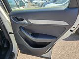 the door of a car with the driver ' s side door open