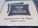 packaging of a blue bed sheet with a pillow on top of it