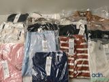 a lot of shirts that are wrapped in plastic
