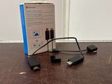 a box that is sitting on the floor next to a charger