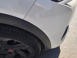 a close up of a car ' s tire on the street