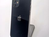 a black iphone sitting on top of a white table