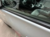 a close up of a car ' s interior with the door open