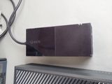 a video game console sitting on top of a wall