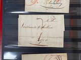 three pieces of paper with writing on them in a display case