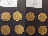 Plusieurs types de pièces d'or sont représentés sur un fond noir
