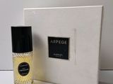 an image of a bottle of perfume sitting next to a box