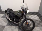 a motorcycle that is sitting on a checkered floor