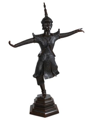 an image of a bronze statue of a woman with her arms outstretched
