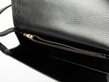 the inside of a black purse with a zipper on it