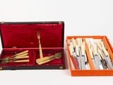 a box with a set of knives and a fork in it