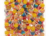 a close up of a bag of colorful lollipops on a white background
