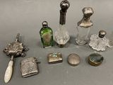 a lot of silver and glass items on the table