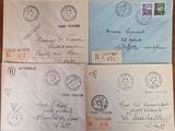 several old envelopes with stamps are sitting on a table