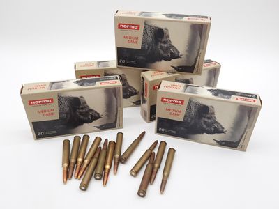 three boxes of ammo cartridges are sitting on a white surface