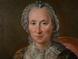 portrait of a woman in a blue dress with a white bonnet