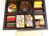 a wooden box filled with assorted items on a table