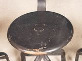 three chairs and a table that are sitting on the floor