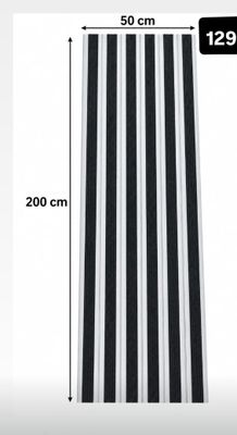 a close up of a black and white striped table runner