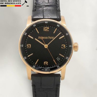 an image of a close up of a wrist watch on a white surface