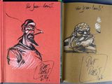 a book with a drawing of a man smoking a cigarette and a book with a drawing of a man smoking a cigarette