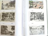 a book opened to show pictures of a city