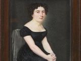 portrait of a woman in a black dress in a wooden frame