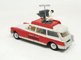a red and white toy car with a man sitting on top of it