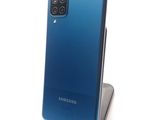 the back of a blue samsung galaxy s20 with a camera attached to it