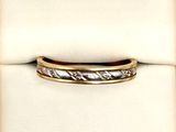 a close up of a wedding ring on a white cloth