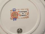 a white plate with a picture of a clock on it