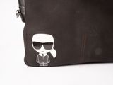 a black bag with a sticker of a man with sunglasses on it