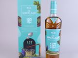 a bottle of macallan concent cept next to a cardboard box