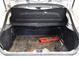 the back of a car with the trunk open and tools in the trunk