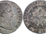 a silver coin with a portrait of a man on it