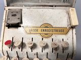 an old typewriter with buttons and numbers on it