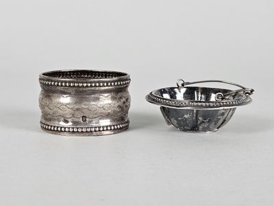 pair of silver napkins and a silver bowl