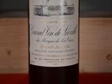 a bottle of wine that is sitting on a table