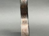 a close up of a ring on a gray surface