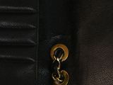 a close up of a wallet with a chain on it