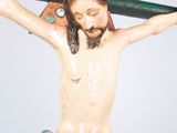 a figurine of jesus on a cross on a table