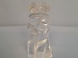 a clear glass vase with a flower on top of it