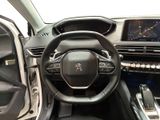 the interior of a car with a steering wheel and dashboard controls