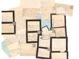 several old letters and envelopes are stacked on top of each other