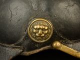 a close up of a helmet with a lion on it