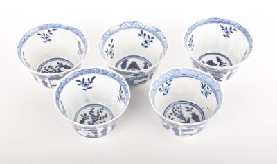 six blue and white bowls with designs on them on a white surface